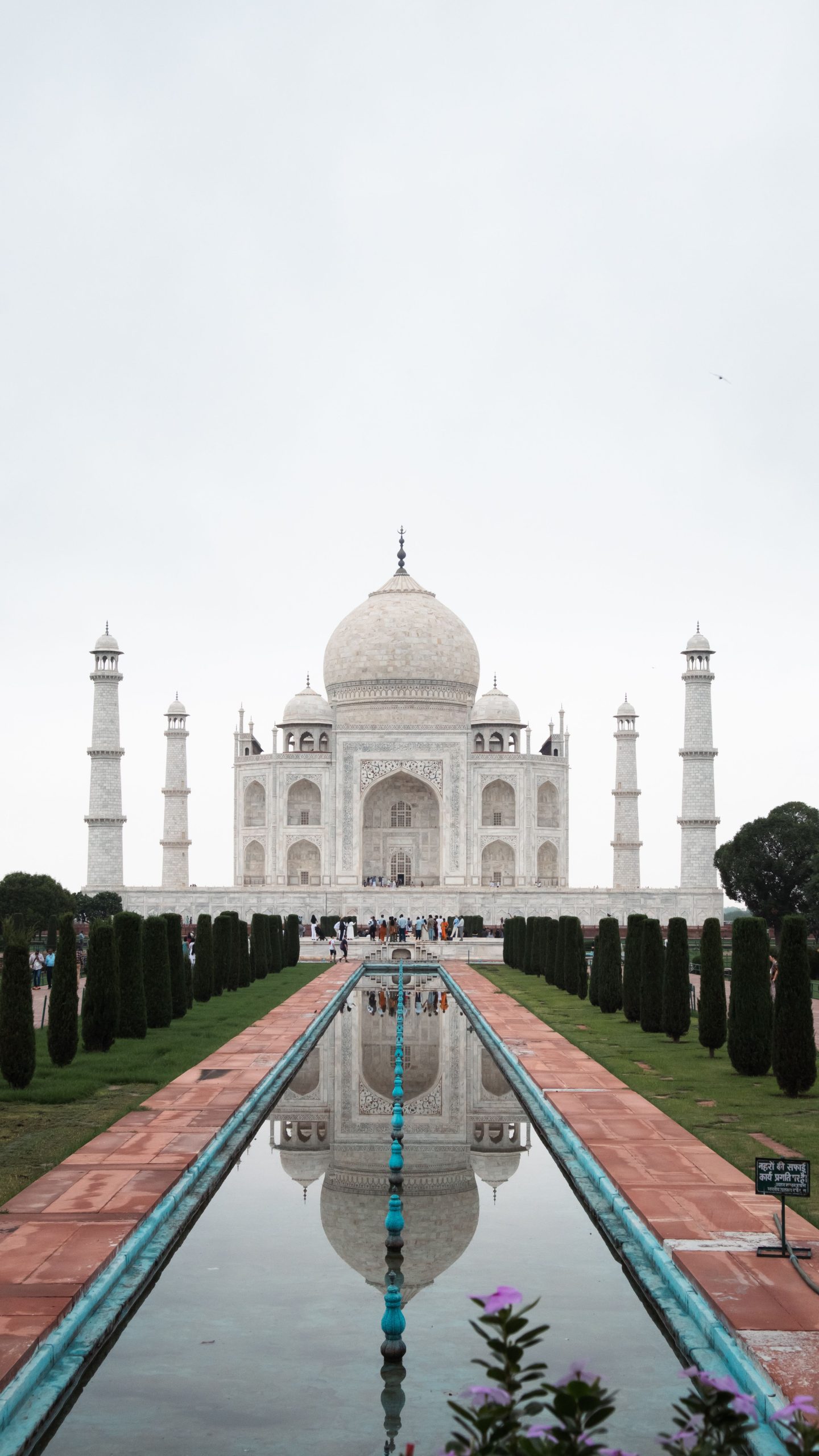 Explore the iconic Taj Mahal with symmetrical reflection enhancing its beauty, capturing timeless elegance.